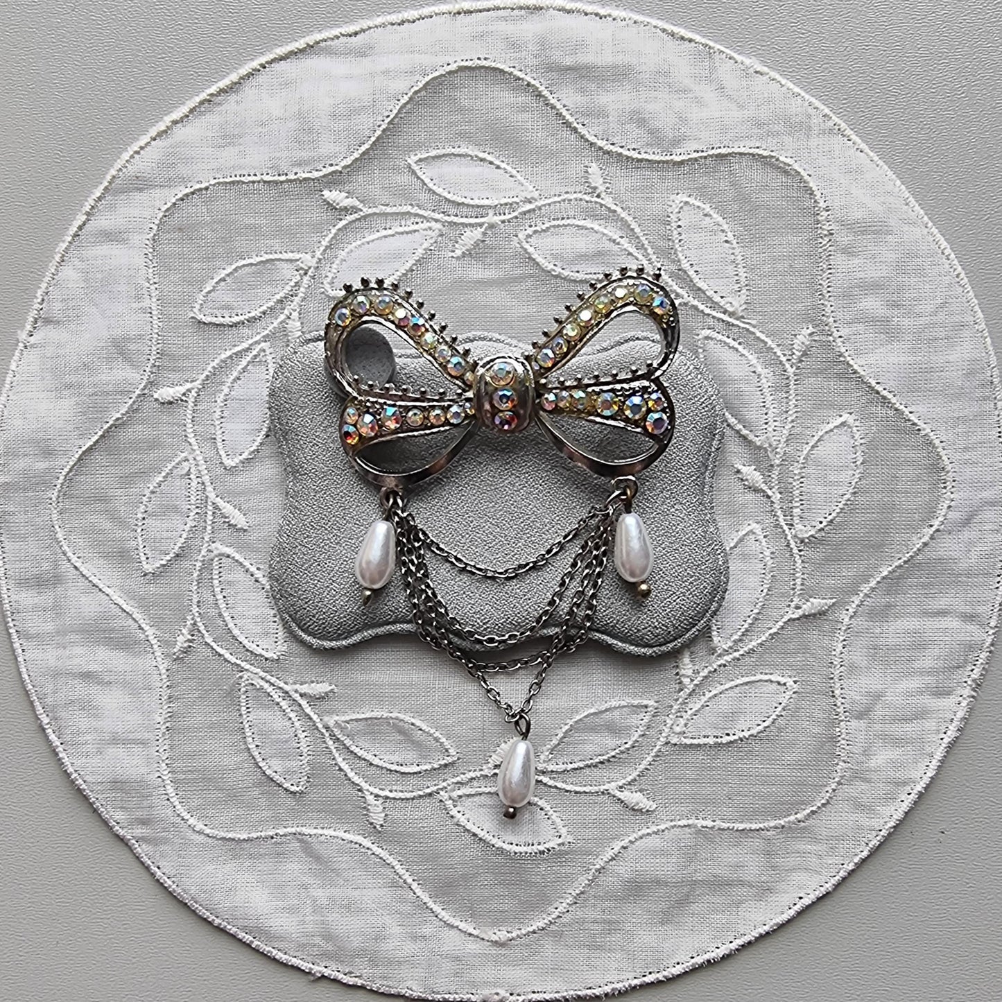 Brooch - Aurora Borealis Crystal Bow with Faux Pearl Chain Drops Brooch