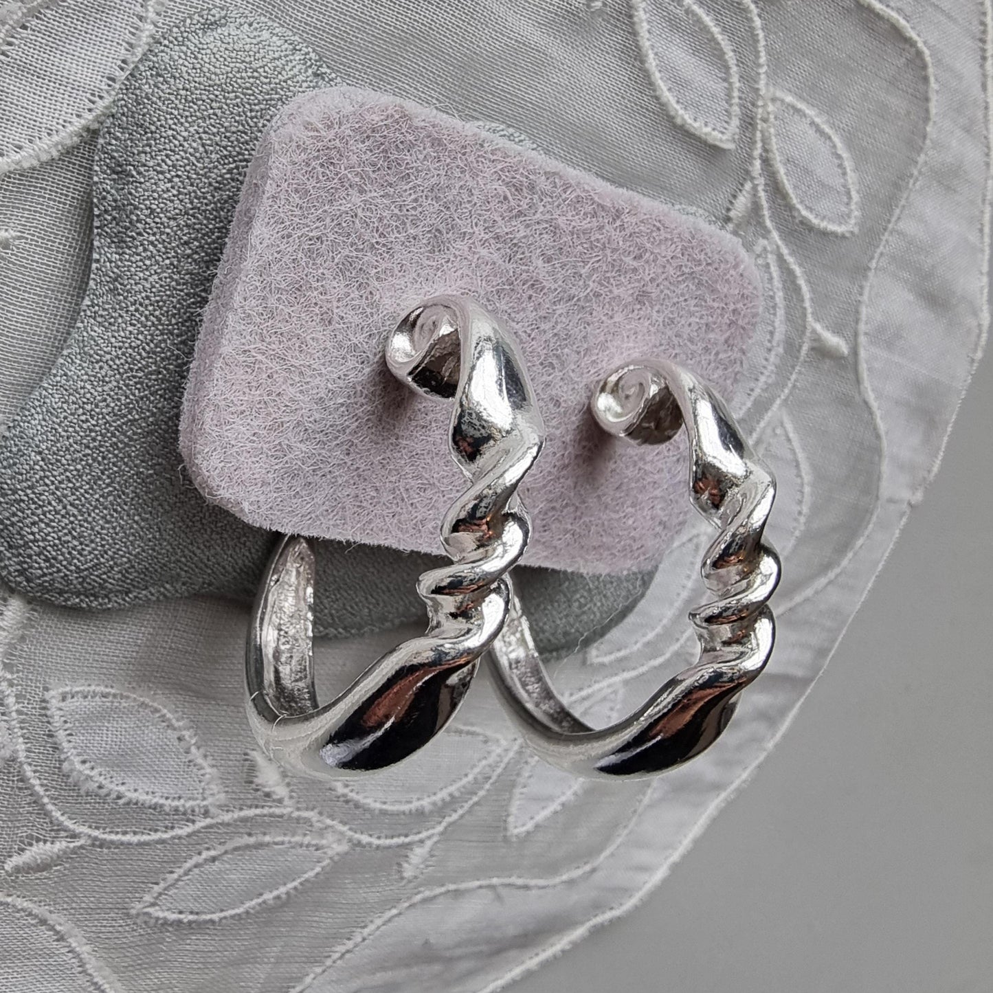 Posts - Silver Tone Twist Hoop Earrings