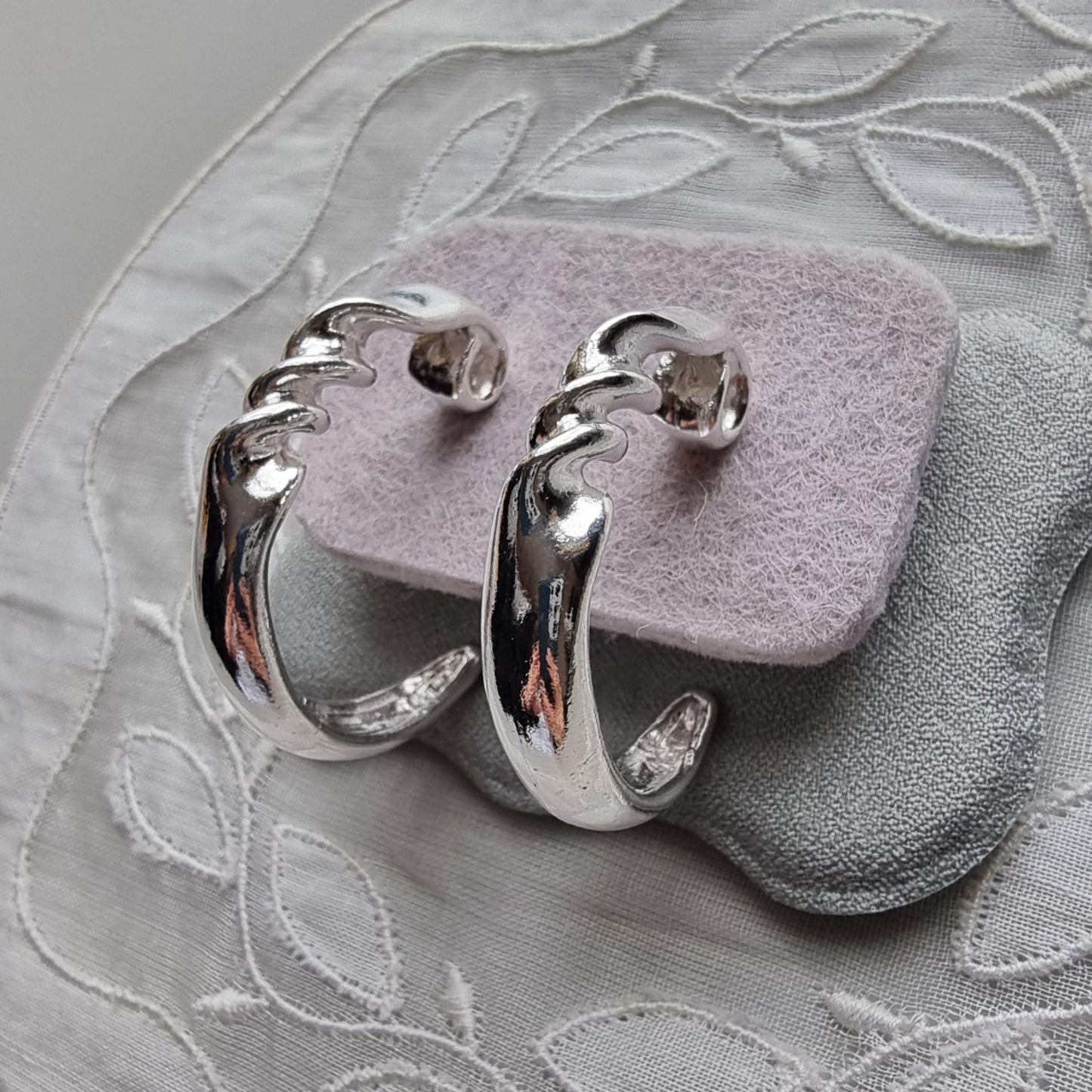 Posts - Silver Tone Twist Hoop Earrings